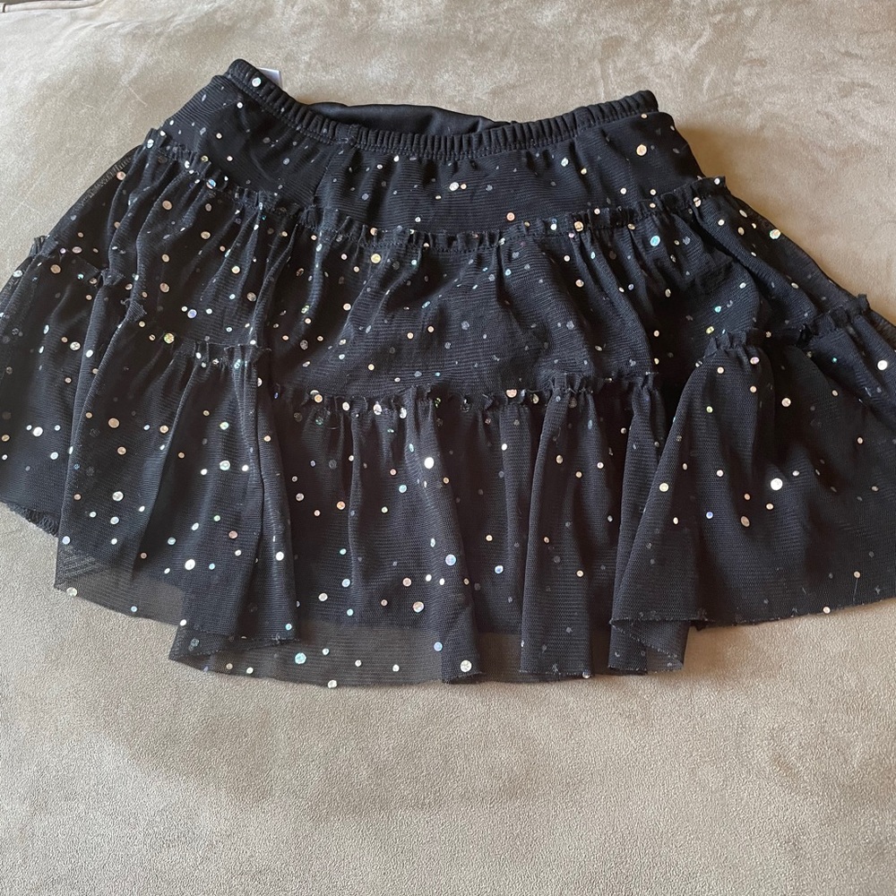 Black polka dot skirt.